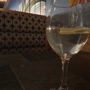 a glass of wine on a table