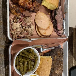 two trays of food on a table