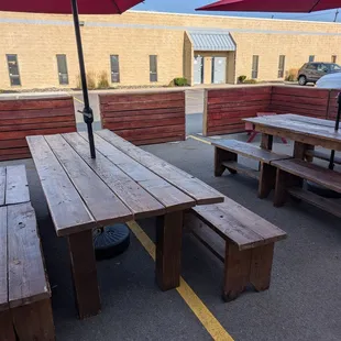 Covered picnic tables outside. (Peep the lil one in the right corner for small humans.)