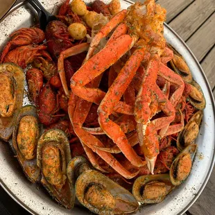 Crawfish, snow crab legs, mussels, and quail eggs