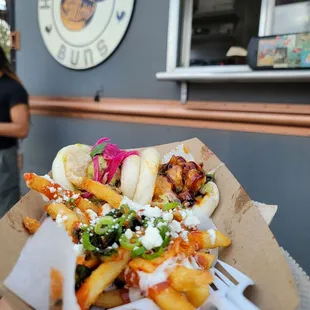 Loaded kimchi fries. Shrimp tempura bao. Pork asada bao.