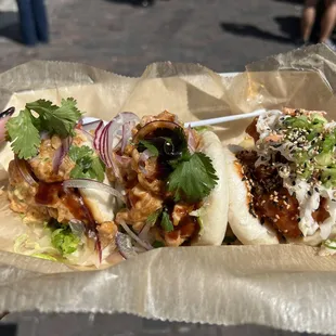 Two tempura shrimp buns on the left, Korean fried chicken on the right