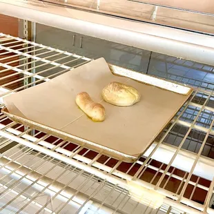 Behold this whopping case display for the entire bakery (Spanish bread and ensaymada)