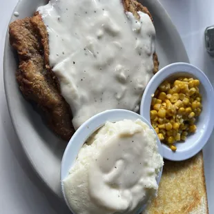 Country fried steak, mashed potatoes with corn