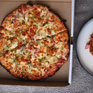 a pizza and a plate of food