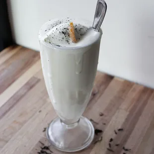 a milkshake with a spoon in it