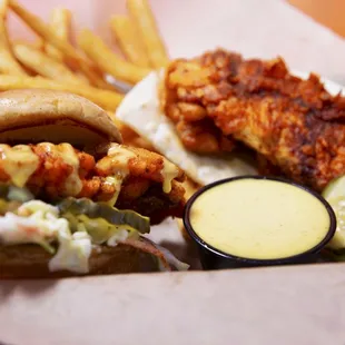 a plate of food with fries and a pickle