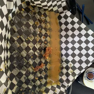 a hot dog in a checkered basket