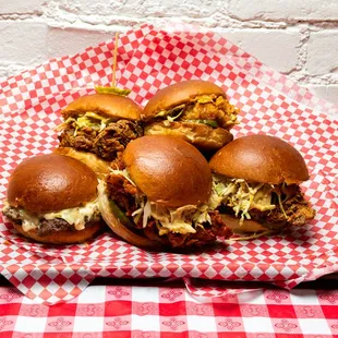 a basket of pulled pork sandwiches