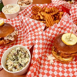 Fried chicken and shrimp sandwiches with fries and different sides