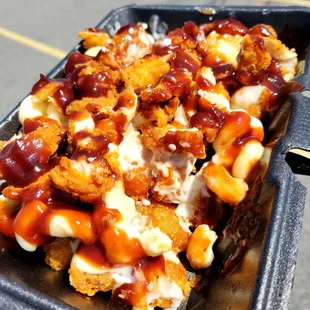 Twisted tots. Tater tots, mac and cheese, chicken, and BBQ sauce.