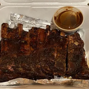 They only give 1 half-filled small container of sauce for a full rack of ribs to go