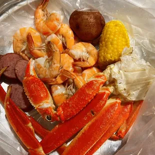a plate of seafood and potatoes
