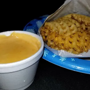 Waffle fries w/ side of cheese for dippin'.