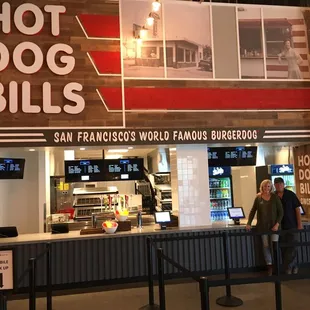 a woman standing in front of the counter
