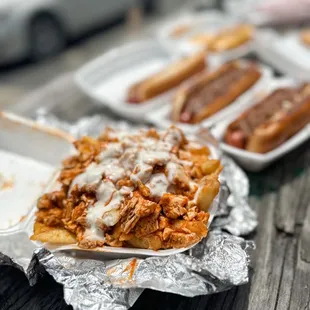 a hot dog covered in bbq sauce