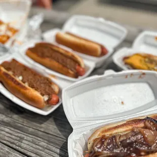 hotdogs in buns and condiments
