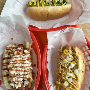 two hot dogs with mustard and ketchup