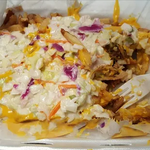 Fries with pulled pork, cheese, and coleslaw