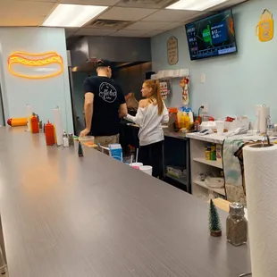 a man and a woman at the counter