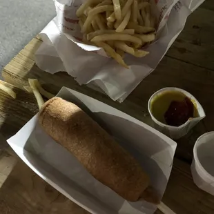 Beef corn dog and fries with ketchup n mustard