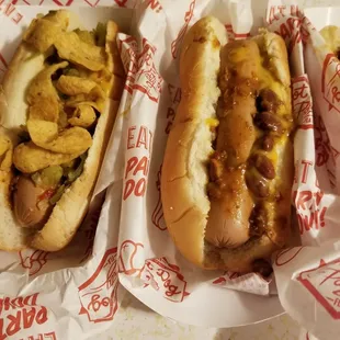 two hot dogs with toppings