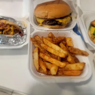 a tray of french fries and a hamburger