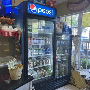 a pepsi cooler and a dog bed