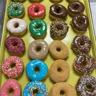 a tray of assorted donuts