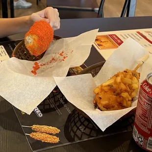 Fire Cheetos covered Mozzarella Corndog on left, Half Mozzarella and Half Hot Dog with Potato Crust on right - sooooo good!!!