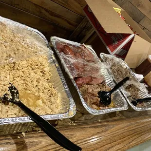 Delicious BBQ meat selection with thick bread and assortment of chips.