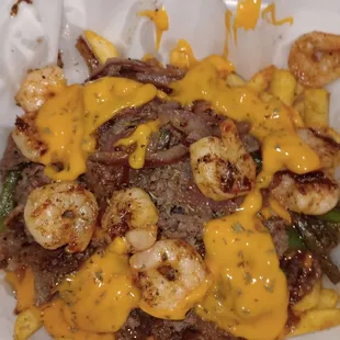 Loaded fries topped with Philly steak ,bell peppers and red onion covered with cheese sauce