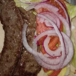Beef Gyro cucumber sauce, lettuce and tomatoes, onions