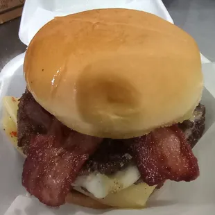 Big triple bacon sauteed onions mustard with 3 all beef patties on a warm buttered bun