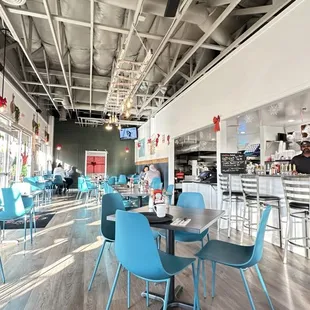 a restaurant with blue chairs