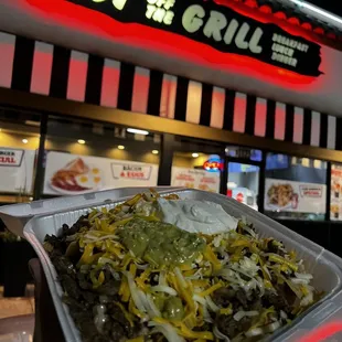 a plate of food in front of a restaurant