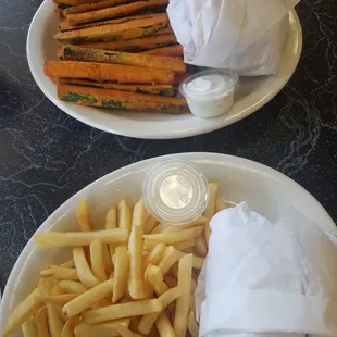 Colossal burger combo with French fries and zucchini sticks