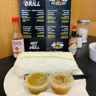 two hot sauces on a plate