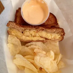 Pressed mac &amp; cheese with Sriracha dipping sauce and a side of classic Lays.