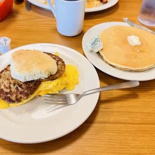 Egg sausage cheese biscuit with side of pancakes