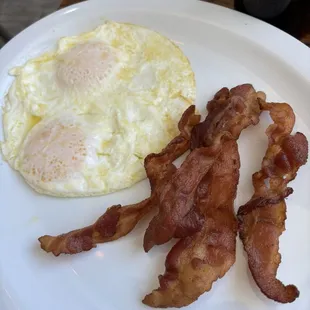 Over easy eggs and extra crispy bacon