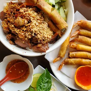 Vermicelli noodle bowl with grilled pork and egg roll