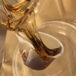 Plastic rock hard syrup. I'm sure it's old and definitely not edible