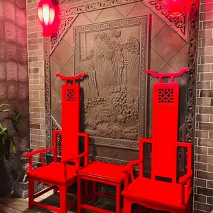 two red chairs and a table