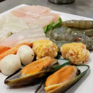 a variety of seafoods on a plate