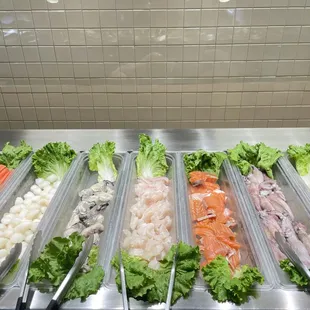 a variety of vegetables in a hot pot