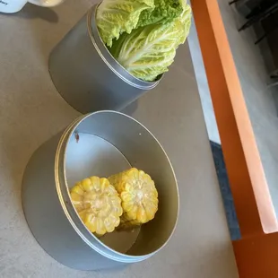 lettuce and corn in tins