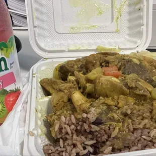 Amazing Curry Chicken Platter with cabbage and rice and pea