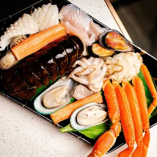a platter of seafood and vegetables