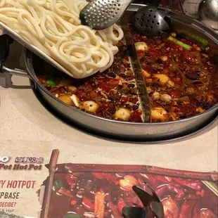 Udon noodles. Spicy vegetarian soup (left) &amp; house soup (right)